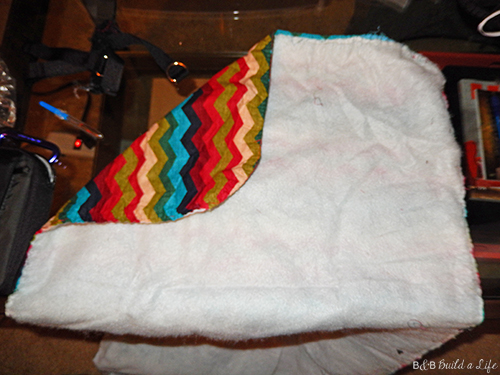 ironing board cover on clearance is turned into an awesome chevron pillow at BandBBuildALife.com